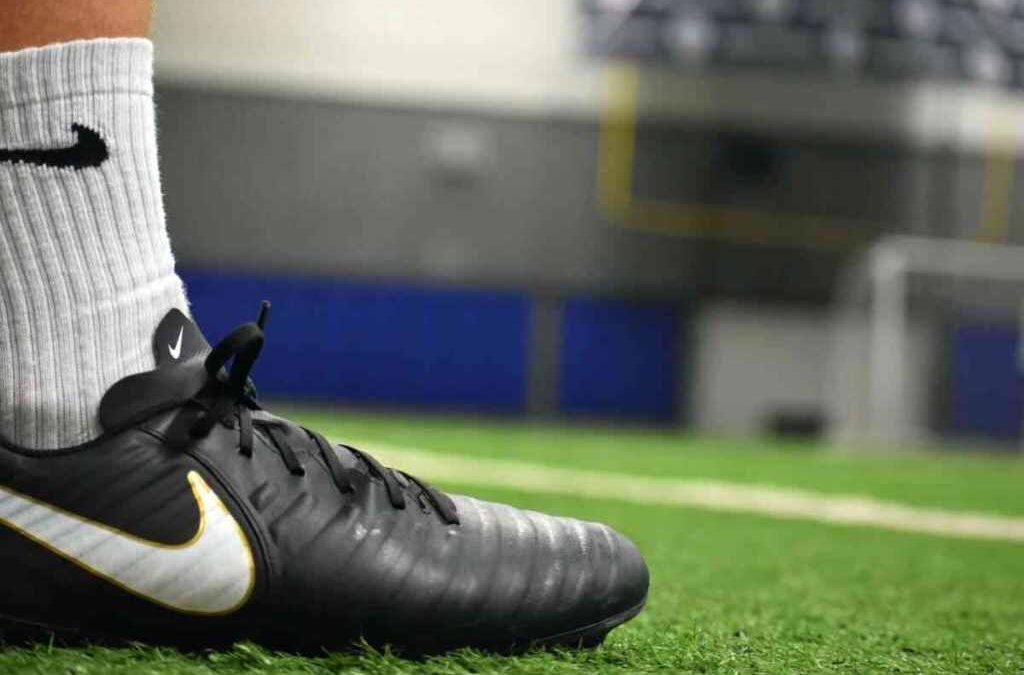 Should you buy football cleats a size bigger