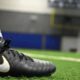 Should you buy football cleats a size bigger