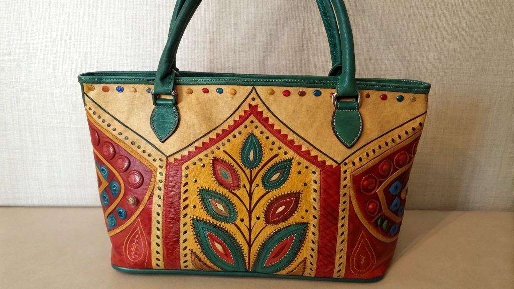 Protecting the paint from fading and peeling of hand painted bag
