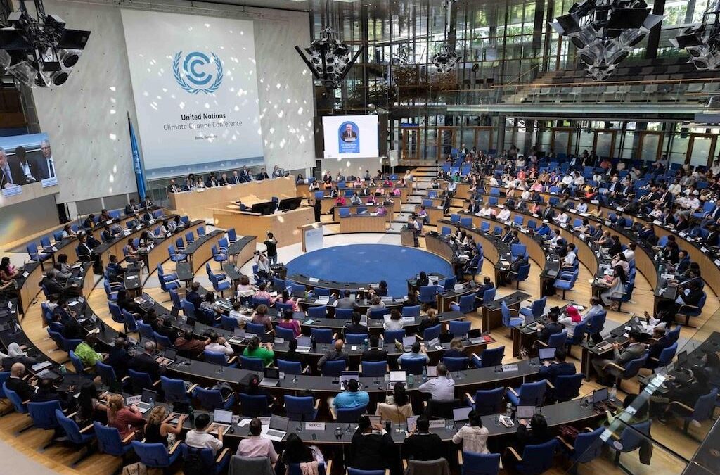 UN and EU officials discussing opposition to solar geoengineering at a global climate meeting