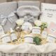 Luxury baby shower gift basket with premium organic skincare products, cashmere blanket, and elegant maternity items for expecting mothers