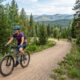Beginner choosing a mountain bike trail based on difficulty and terrain