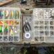 Essential fishing gear arranged in a tackle box